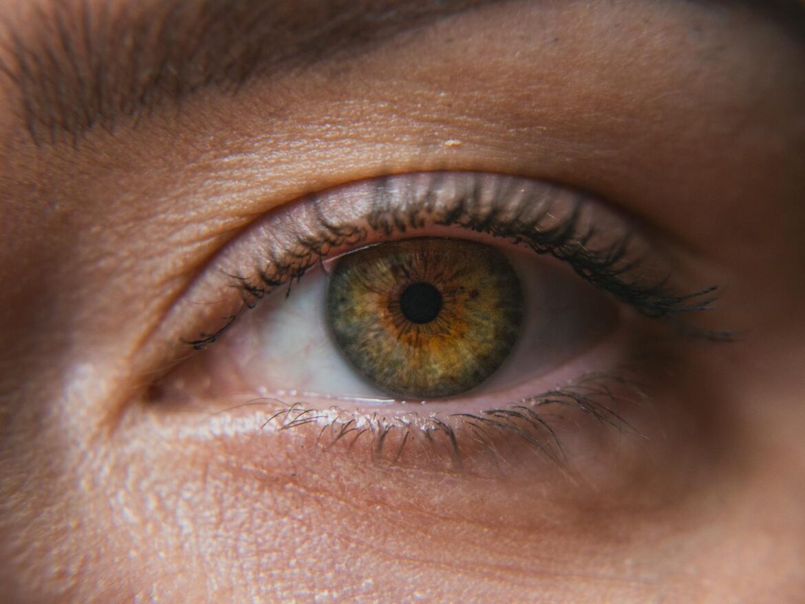Macro shot revealing the intricate details and colors of a human eye.